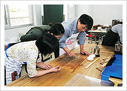 Students practicing repair of historical documents